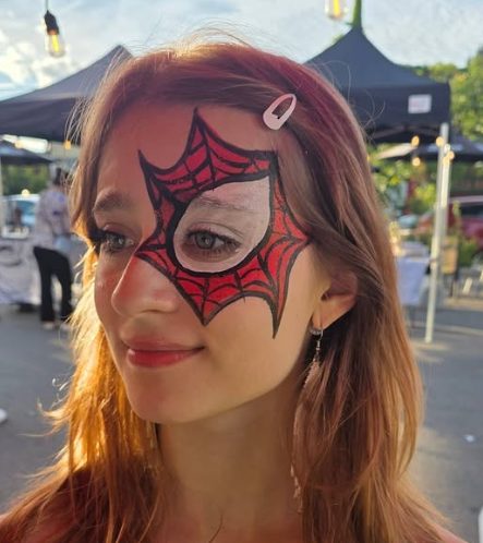 Spiderweb design face painting by Expressive Unicorns