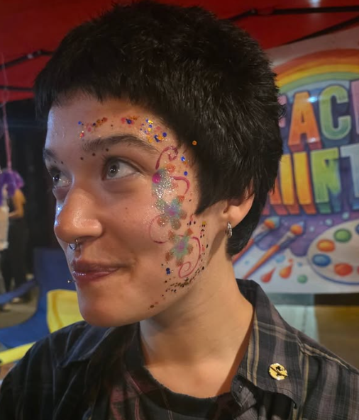 Glitter swirl floral face painting by Expressive Unicorns